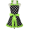 A black polka dot ruffle apron with lime green trim and pockets displayed on a mannequin.