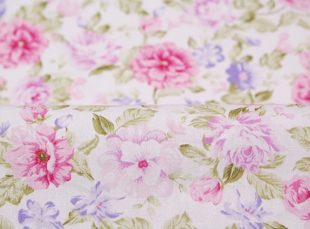 Pink floral and stripe cotton twill fabric with pink, purple, and green flowers