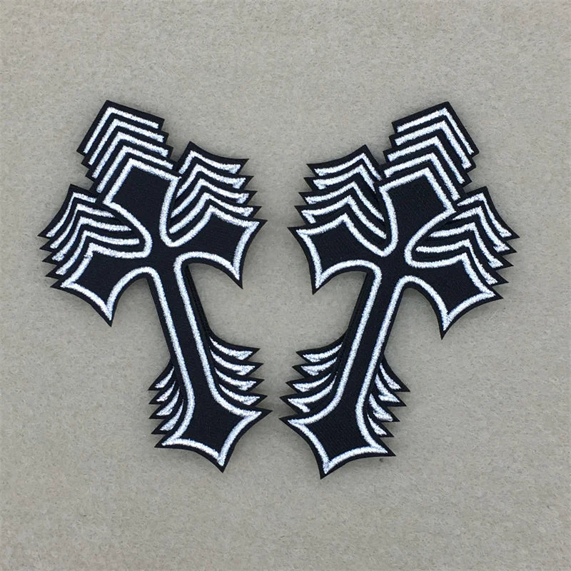 Pair of black and white embroidered cross applique patches with textured edges