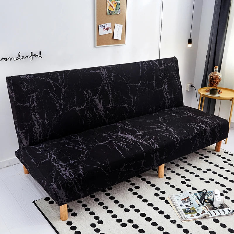 Black geometric print spandex slipcovers on a sofa bed.
