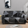 A modern gray and black sofa protector cover featuring a geometric pattern with copper accents.