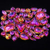 A close-up of a set of 50 pink and purple faceted rhinestones arranged in a decorative pattern.