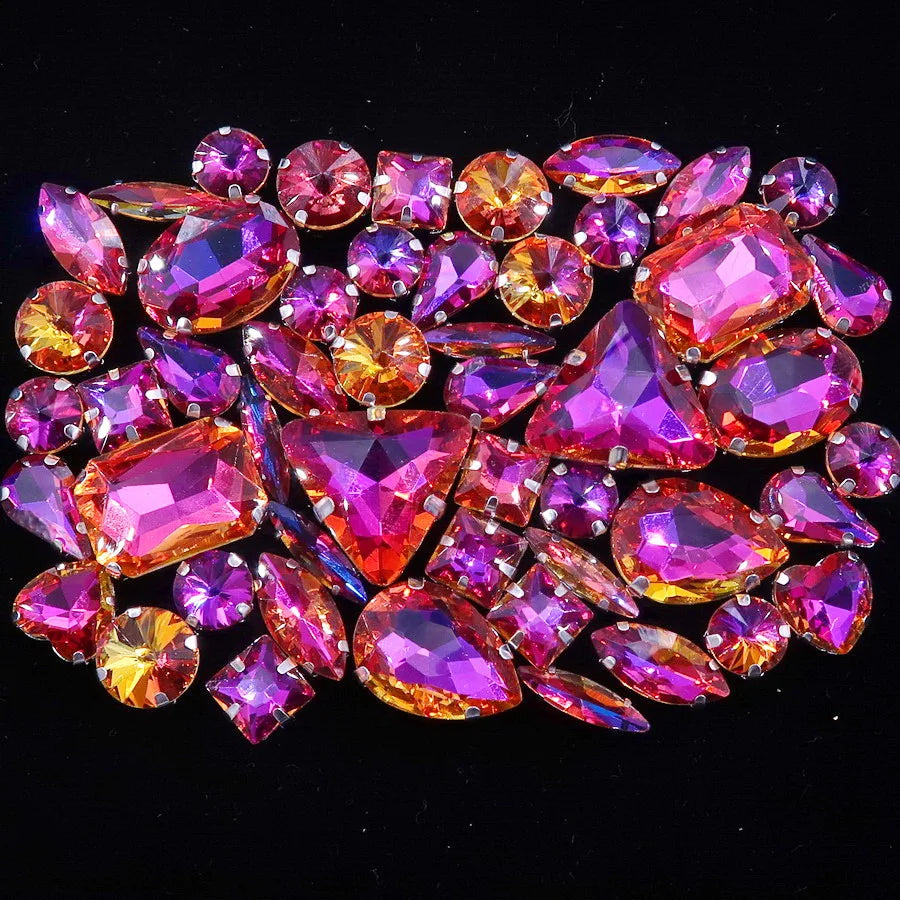 A close-up of a set of 50 pink and purple faceted rhinestones arranged in a decorative pattern.