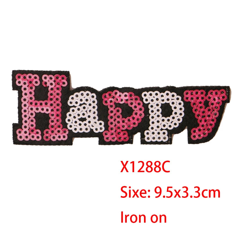 Iron-on patch featuring the word HAPPY made of pink sequins on black fabric