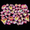 A collection of 50 pink and yellow faceted rhinestone gems arranged in a cluster.