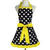 A yellow polka dot ruffle apron with pockets displayed on a mannequin.