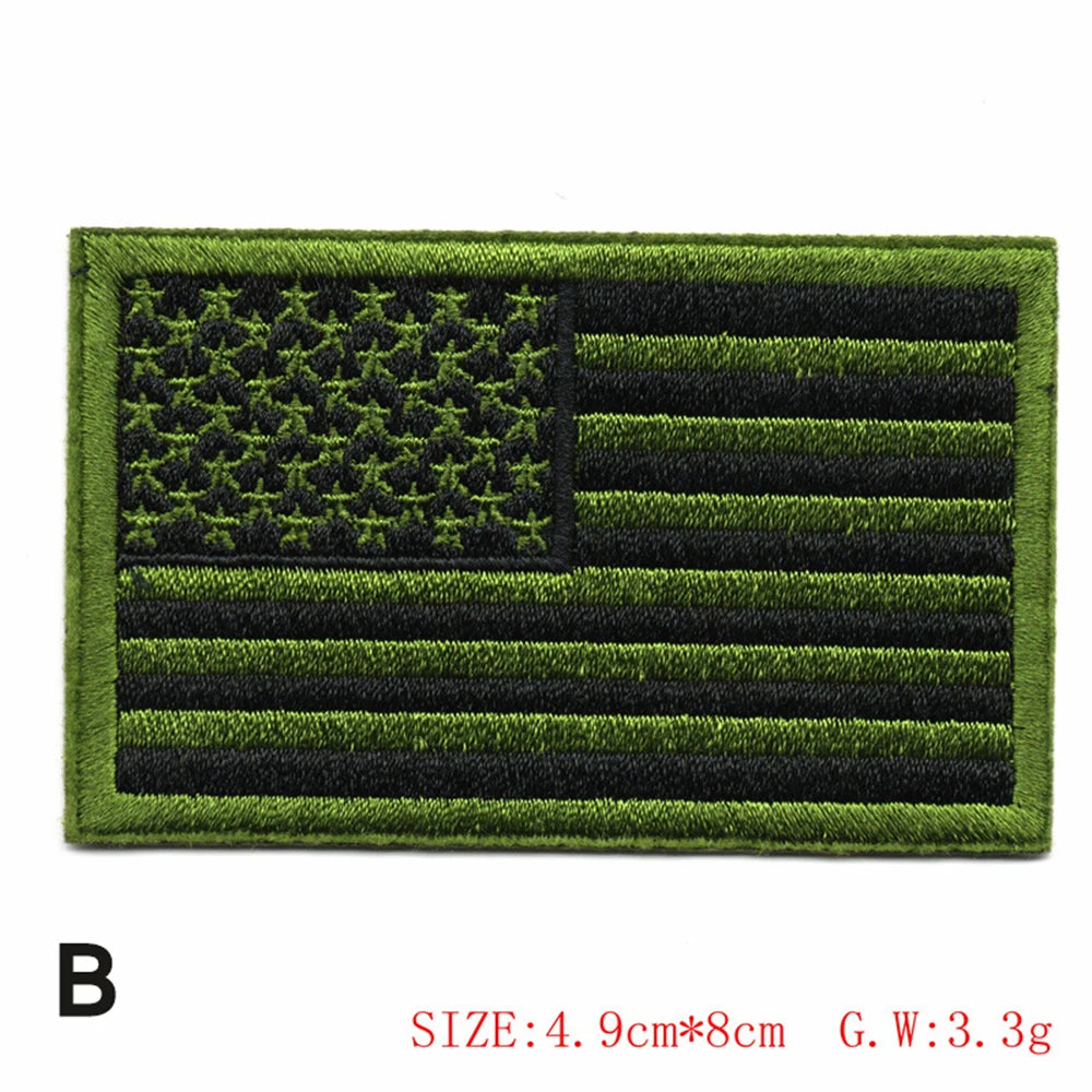 Embroidered American flag patch featuring the stars and stripes design on a green fabric background