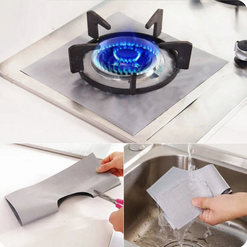 A set of four reusable non-stick gas stove cleaning mats being used to clean a stovetop.