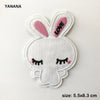 White embroidered bunny patch with pink accents and a heart design