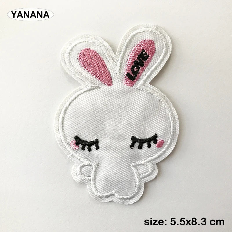 White embroidered bunny patch with pink accents and a heart design
