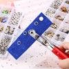 A hand uses pliers to remove metal snap fasteners from a clear plastic kit organized in compartments.