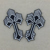 Pair of black and white embroidered cross applique patches with textured edges