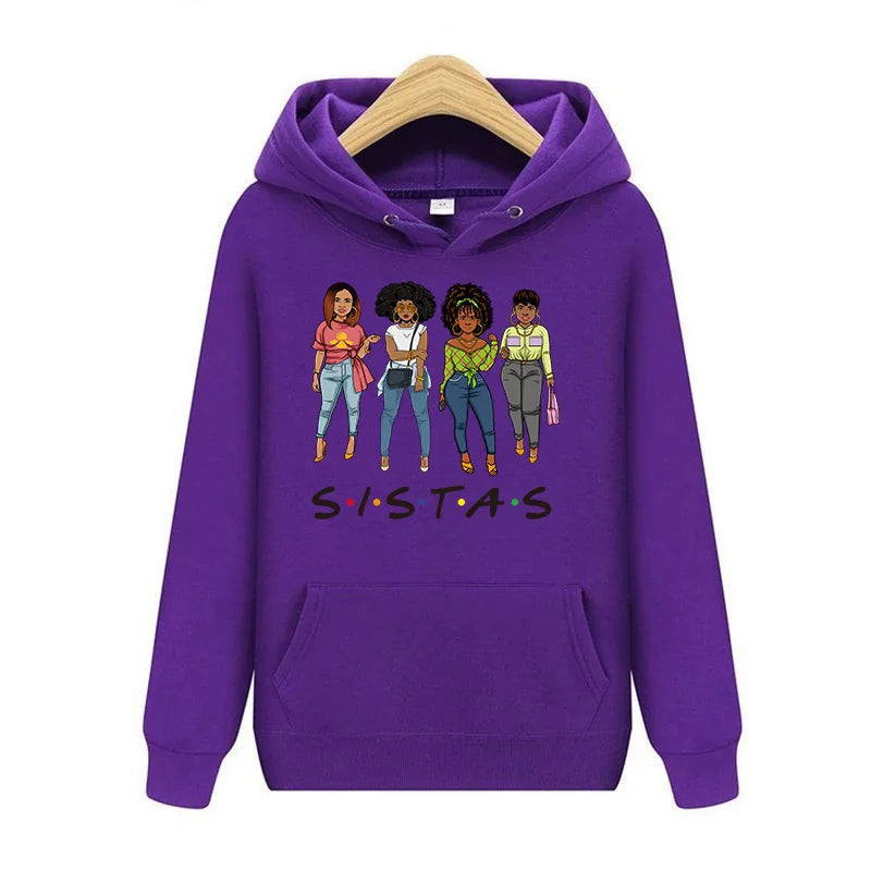 Purple hoodie featuring a graphic of five diverse women with the text SISTAS printed on the chest.