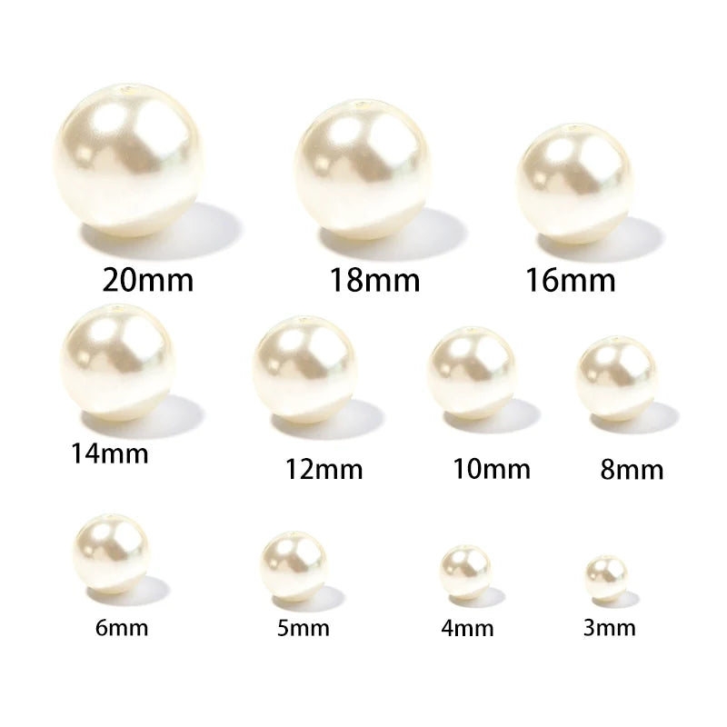 A set of imitation pearl beads shown in various sizes ranging from 6mm to 20mm.