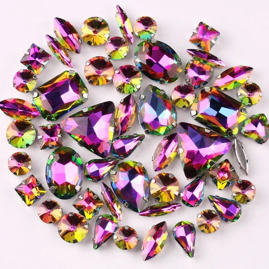 A collection of 50 silver claw rhinestone decorations in various shades of purple, green, and gold.