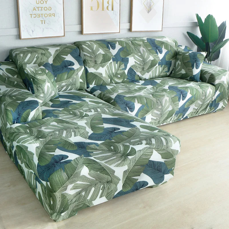 L-shaped sofa protector covers featuring a tropical leaf pattern in shades of green and blue.