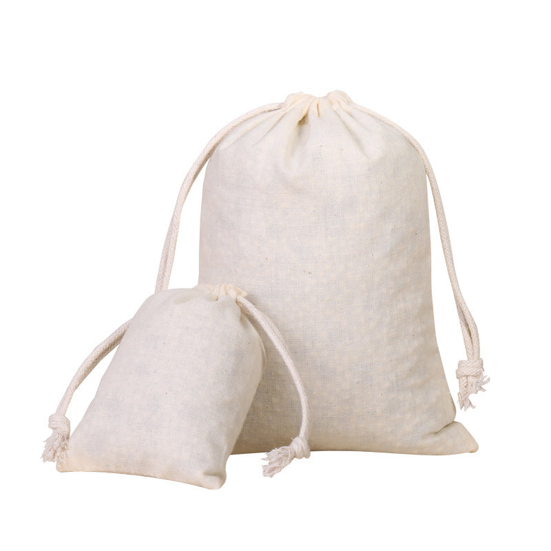 A natural off-white cotton drawstring gift bag with light beige string, shown against a white background.