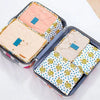 A set of six fabric storage organizers for clothes, featuring various pastel and patterned fabrics.