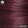 A spool of deep maroon waxed thread embroidery cord with a black label and the product code ML0039.