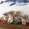 A collection of handmade cotton toy filler batting animals in various colors and outfits.