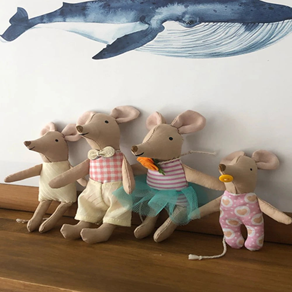A collection of handmade cotton toy filler batting animals in various colors and outfits.
