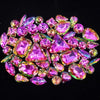 A close-up of a set of colorful pink and green rhinestones arranged in a decorative pattern.
