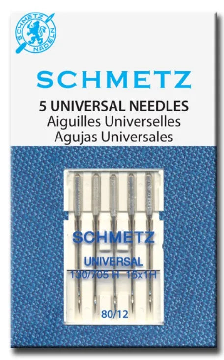 A box of five Schmetz universal sewing machine needles labeled in German and Spanish.