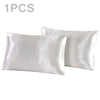 One pair of white silky satin pillowcases shown flat.