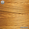 A close-up view of yellow waxed thread embroidery cord stacked in a bundle.