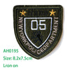 Dark olive green embroidered iron-on patch with white lettering and the number 05 and a star.