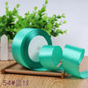 Roll of 4 cm wide satin ribbon in mint green for gift wrapping and DIY crafts