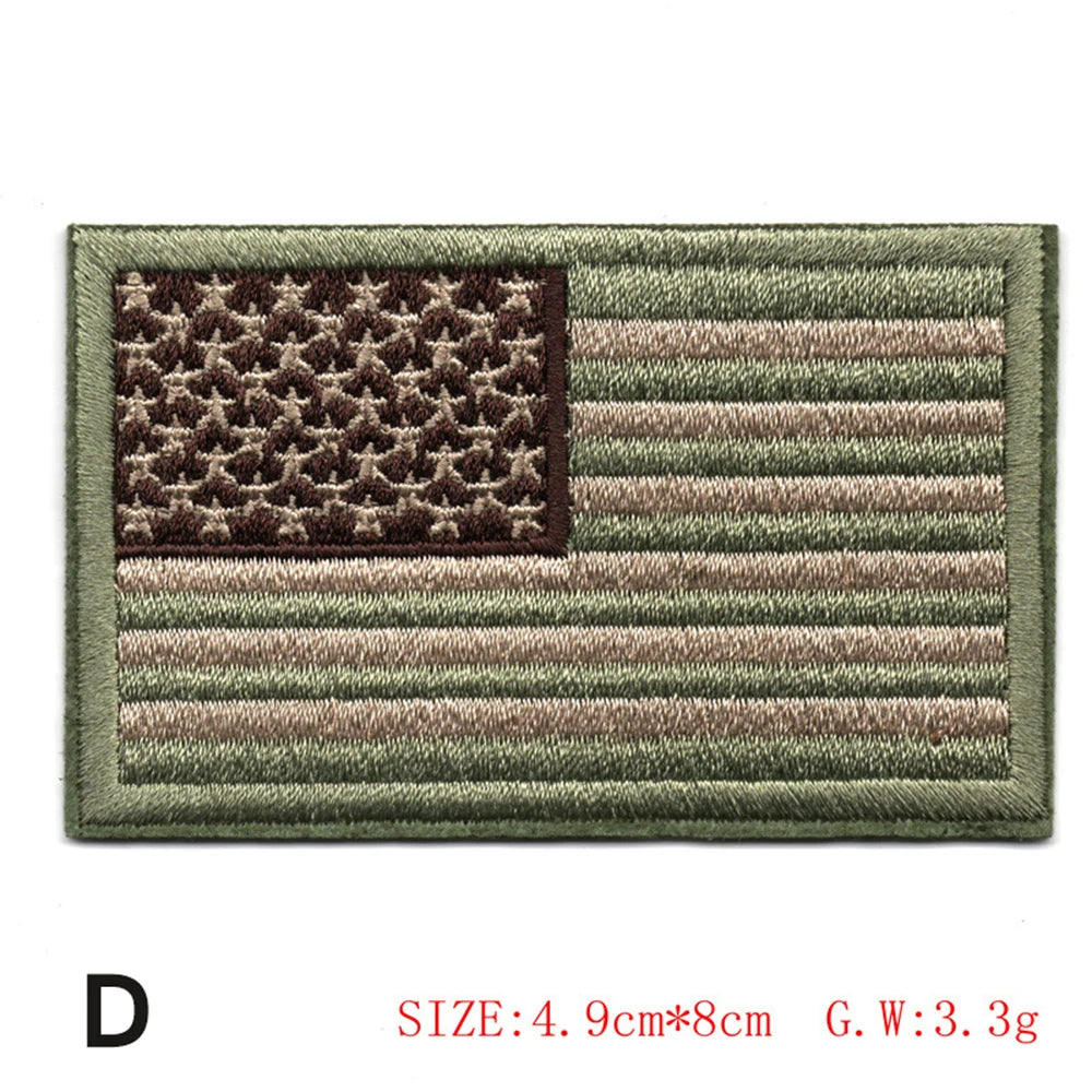 Embroidered American flag patch featuring the stars and stripes design on a green fabric background.