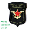 Black embroidered iron-on patch featuring a star design with wings and the word AIRBORNE
