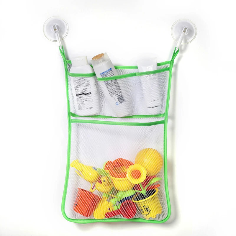 A green mesh storage bag filled with white bath toys, including a bottle and various yellow and orange duck frog bath toys.