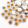 Silver and amber crystal rhinestone sew-on buttons arranged in a floral pattern