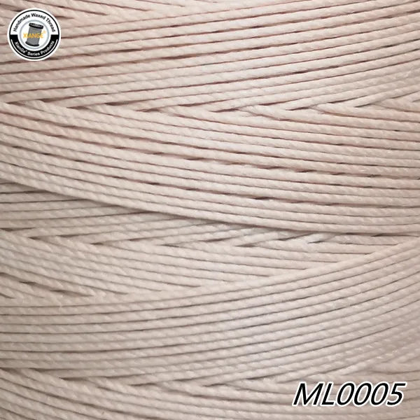 Spool of light beige waxed thread embroidery cord with a black and white logo visible.