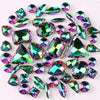 A collection of 50 silver claw rhinestone decorations in various shades of green and iridescent colors.