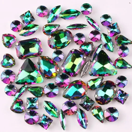 A collection of 50 silver claw rhinestone decorations in various shades of green and iridescent colors.