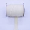 A roll of beige durable bias tape binding ribbon on a white stand.