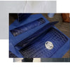 A dark blue leather wallet featuring textured stitching and a silver metal accent.