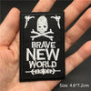 Black embroidered patch featuring a skull and crossbones design with the text BRAVE NEW WORLD
