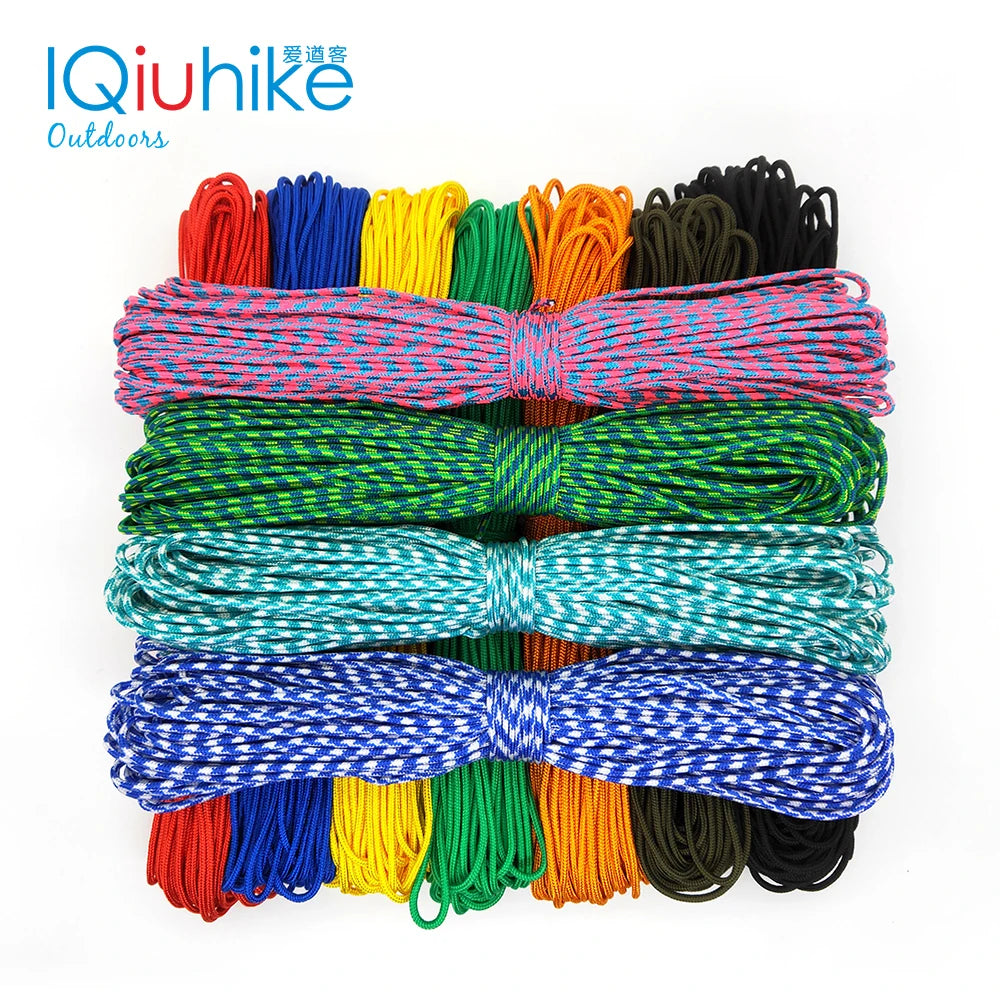 A collection of multi-colored paracord ropes in various colors and thicknesses laid out for display.