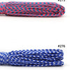 A collection of multi-colored paracord ropes in various colors and thicknesses, bundled together.