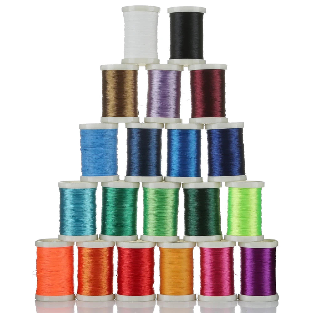 A stack of 150M multi-braided polyester fishing line spools in various colors including white, black, purple, green, blue, an