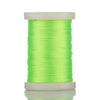 A spool of bright lime green multi-braided polyester fishing line on a white plastic spool.