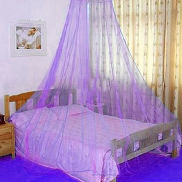 An elegant mosquito net canopy draped over a wooden bed, featuring purple sheer netting.