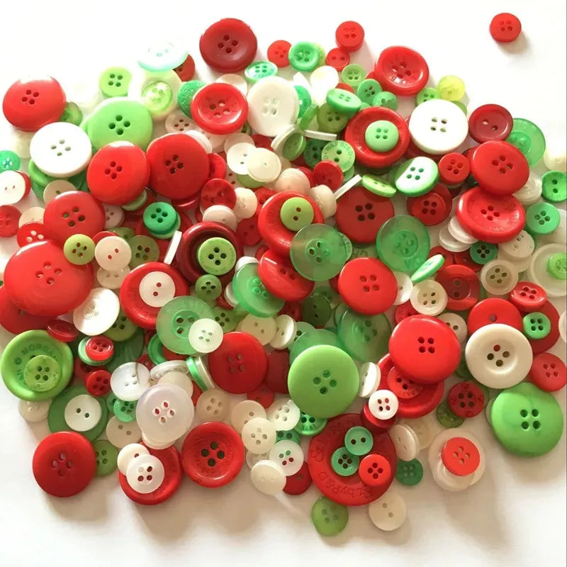A pile of mixed size wooden buttons in various shades of red, green, and white on a white background.