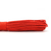 A bundle of bright orange paracord rope coiled and laid out horizontally.