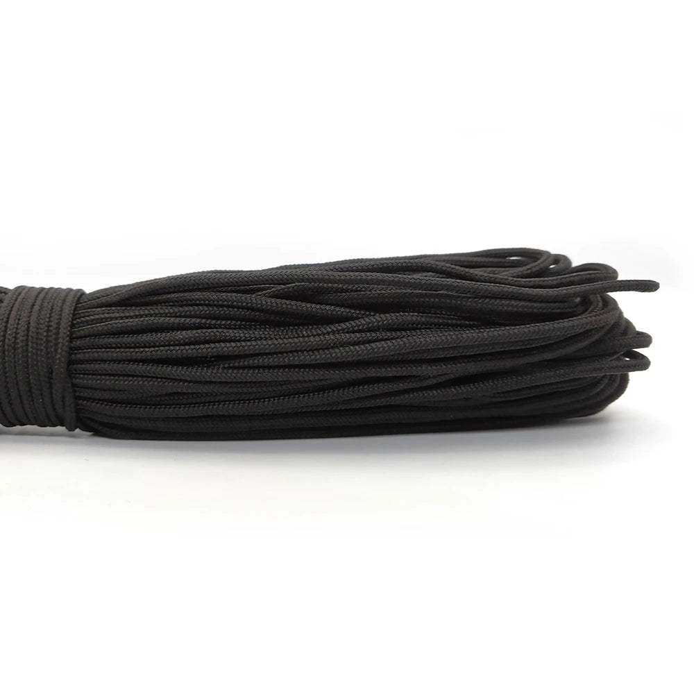 A bundle of black 2mm paracord rope coiled together.