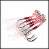 A coil of multi-braided red and white fishing line is shown against a white background.